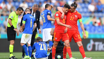 Ethan Ampadu of Wales looks dejected with team mate Gareth Bale after he is shown a red card by Match Referee, Ovidiu Hategan during the UEFA Euro 2020 Championship Group A match between Italy and Wales at Olimpico Stadium on June 20, 2021 in Rome, Italy.