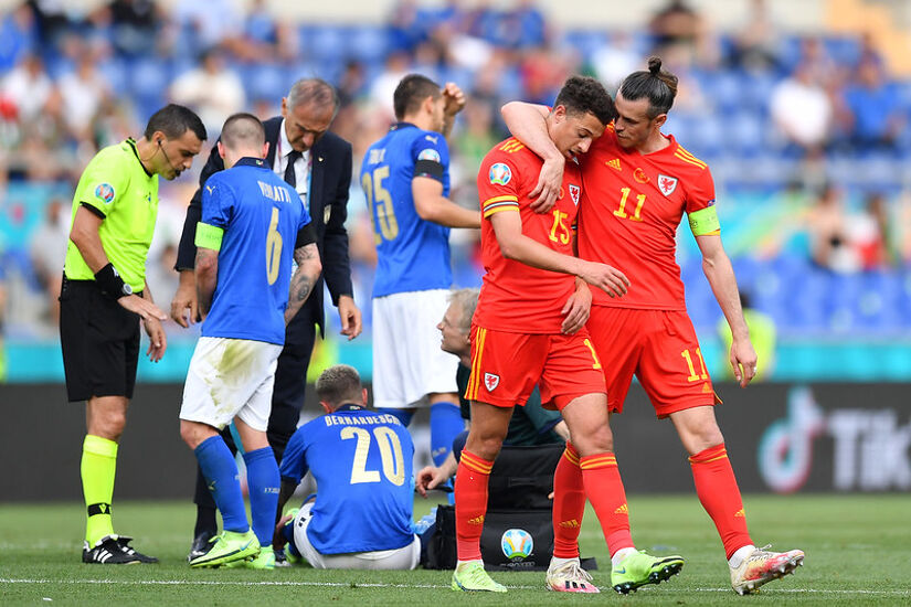 Ethan Ampadu of Wales looks dejected with team mate Gareth Bale after he is shown a red card by Match Referee, Ovidiu Hategan during the UEFA Euro 2020 Championship Group A match between Italy and Wales at Olimpico Stadium on June 20, 2021 in Rome, Italy.