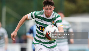 Christy McLoughlin of Cockhill Celtic keeps his eyes on the ball against ST Mochta's in an FAI Intermediate Cup game in 2021