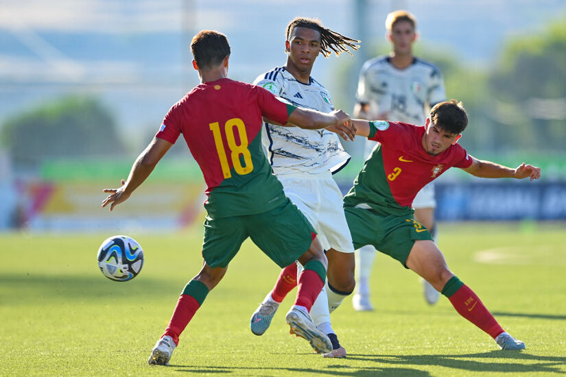 TA' QALI, MALTA - JULY 6: Cher N'dour of Italy in action against Samuel Justo, 18, and António Ribeiro of Portugal during the UEFA European Under-19 Championship Finals 2022/23 group A match between Portugal and Italy at the Centenary Stadium