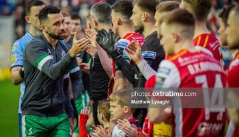 Hoops skipper Pico Lopes leads his team in the pre-match handshakes with the Saints ahead of their league game in Inchicore in April 2024