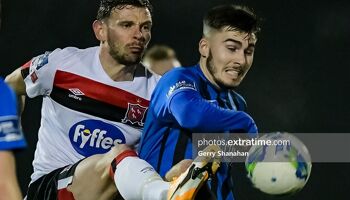 Dundalk's Andy Boyle competes for the ball with Athlone Town's Ronan Manning.