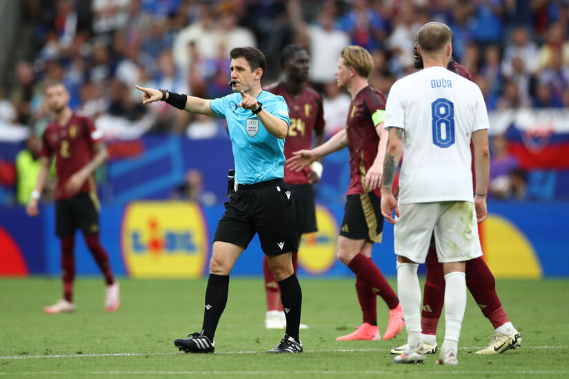 Referee Umut Meler, who will officiate England v Slovakia, gestures as he disallows the goal scored by Romelu Lukaku of Belgium after a handball decision via a VAR Review, during the EURO 2024 group stage match between Belgium and Slovakia in Frankfurt