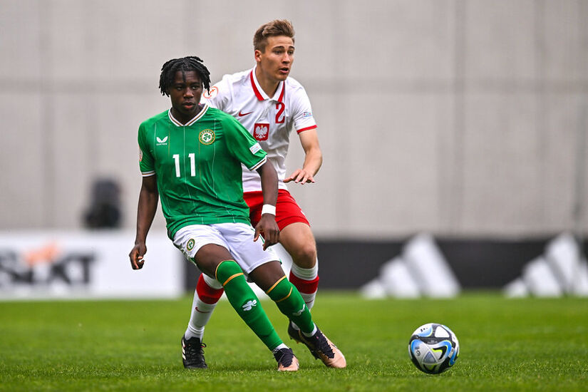 Ikechukwu Orazi of Republic of Ireland in action against Dominik Szala of Poland during the UEFA European Under-17 Championship Finals 2023 Group A match between Poland and Republic of Ireland in Budapest in May