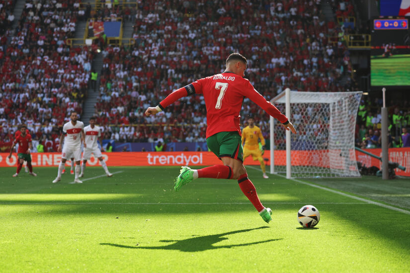 Cristiano Ronaldo of Portugal crosses the ball during the UEFA EURO 2024 group stage match between Turkiye and Portugal at Football Stadium Dortmund on June 22, 2024 in Dortmund, Germany