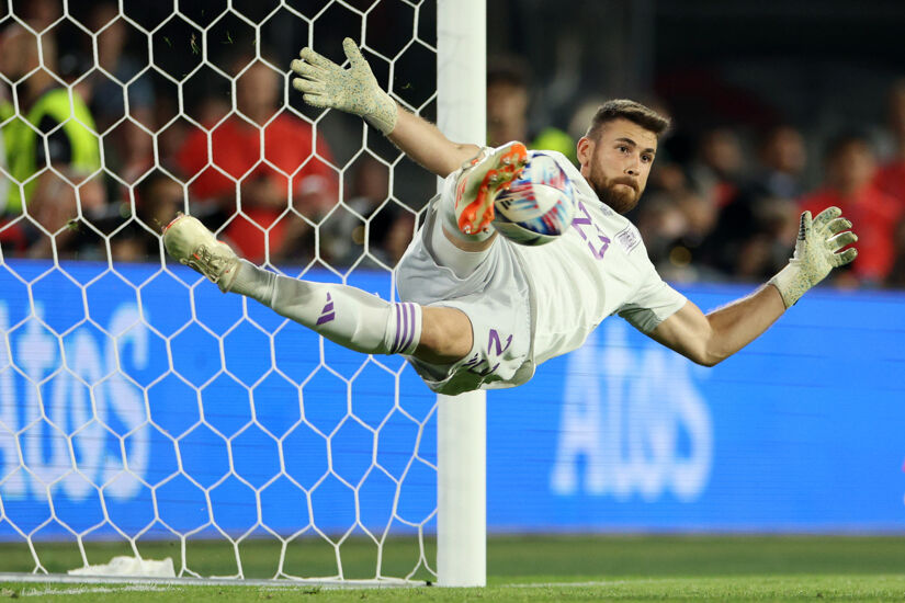 Unai Simon of Spain saves the fourth penalty from Lovro Majer of Croatia (not pictured) in the penalty shoot out during the UEFA Nations League 2022/23 final match between Croatia and Spain at De Kuip