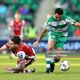 Ruairi Keating of St. Patrick's Athletic FC is tackled by Roberto Lopes of Shamrock Rovers FC during the SSE Airtricity Men's Premier Division match between Shamrock Rovers FC and St. Patrick's Athletic FC at Tallaght Stadium, Dublin