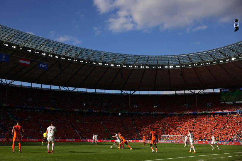 General view inside the stadium as Florian Grillitsch of Austria is challenged by Donyell Malen of the Netherlands during the UEFA EURO 2024 group stage match between Netherlands and Austria at Olympiastadion on June 25, 2024 in Berlin