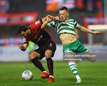 Jordan Doherty and Andy Lyons battle it out at Dalymount Park