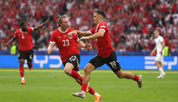Christoph Baumgartner of Austria celebrates scoring his team's second goal with teammate Patrick Wimmer during the UEFA EURO 2024 group stage match between Poland and Austria at Olympiastadion on June 21, 2024 in Berlin