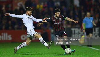 Jordan Flores of Bohemian FC feels pressure from Connor Malley of Sligo Rovers FC