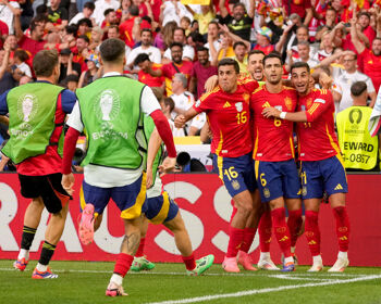 Mikel Merino of Spain celebrates with his teammates Rodri and Ferran Torres after scoring their team's second goal during the UEFA EURO 2024 quarter-final match between Spain and Germany at Stuttgart Arena on July 05, 2024