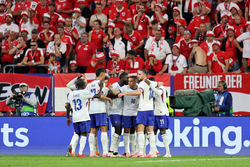 Kylian Mbappe of France celebrates with teammates after Maximilian Woeber of Austria (not pictured) concedes an own goal after deflecting a cross during the UEFA EURO 2024 group stage match between Austria and France at Düsseldorf Arena