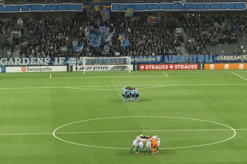 Djurgarden and Shamrock Rovers teams in huddles ahead of kick-off in their Europa Conference League clash in Sweden