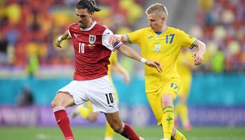  Florian Grillitsch of Austria battles for possession with Oleksandr Zinchenko of Ukraine during the UEFA Euro 2020 Championship Group C match between Ukraine and Austria at National Arena on June 21, 2021 in Bucharest, Romania