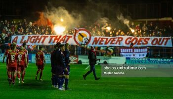 Saints fans create an atmosphere at Tolka Park ahead of the Shelbourne -v- St Patrick's Athletic game in the Premier Division on Friday, 18 February 2022.