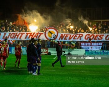 Saints fans create an atmosphere at Tolka Park ahead of the Shelbourne -v- St Patrick's Athletic game in the Premier Division on Friday, 18 February 2022.