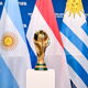 A view of the FIFA World Cup Winner's Trophy with the flags of the hosts of the matches of the FIFA World Cup 2030 Centenary Celebration Uruguay, Argentina and Paraguay during a trophy shoot at the Home of FIFA on December 11, 2024 in Zurich