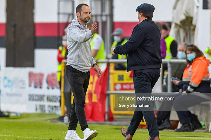 John Martin pictured when Longford Town assistant manager greeting then Waterford boss manager Marc Bircham in June 2021