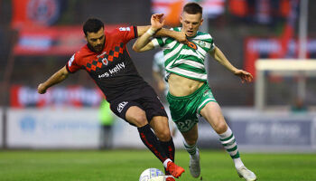 Jordan Doherty and Andy Lyons battle it out at Dalymount Park