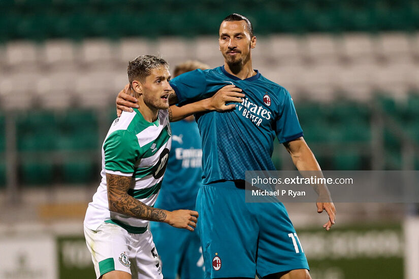 Zlatan Ibrahimović battles with Shamrock Rovers' Lee Grace during Milan's 2-0 Europa League qualifier win in Tallaght in 2020.