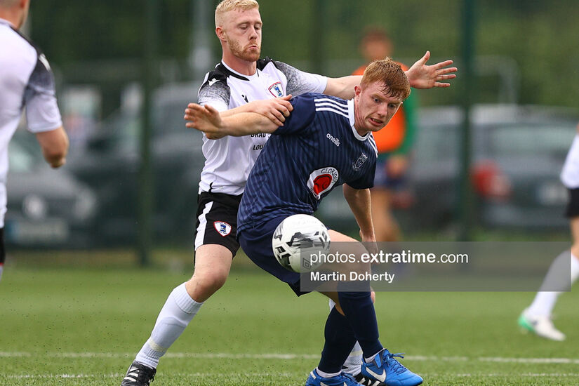 Cian Browne of Villa FC holds off Maynooth University Town's Sean Traynor when the sides met in the FAI Cup first round in 2022.