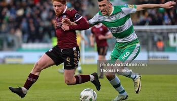 Aodh Dervin of Galway United FC feels pressure from Aaron Greene of Shamrock Rovers FC during the SSE Airtricity Men's Premier Division match between Shamrock Rovers FC and Galway United FC at Tallaght Stadium, Dublin on April 26, 2024