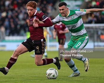 Aodh Dervin of Galway United FC feels pressure from Aaron Greene of Shamrock Rovers FC during the SSE Airtricity Men's Premier Division match between Shamrock Rovers FC and Galway United FC at Tallaght Stadium, Dublin on April 26, 2024