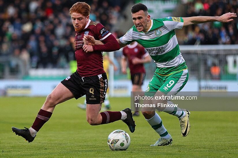 Aodh Dervin of Galway United FC feels pressure from Aaron Greene of Shamrock Rovers FC during the SSE Airtricity Men's Premier Division match between Shamrock Rovers FC and Galway United FC at Tallaght Stadium, Dublin on April 26, 2024