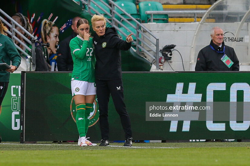 Vera Pauw chats to sub Izzy Atkinson who replaced an injured Katie McCabe in the first half
