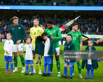 Andrew Omobamidele gives us warm up top to ball kid ahead of kick-off at a cold Aviva Stadium on Tuesday night