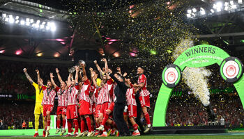 Olympiacos captain Konstantinos Fortounis lifts the UEFA Europa Conference League trophy alonside his teammates after the UEFA Europa Conference League 2023/24 Final match between Olympiacos FC and ACF Fiorentina at the AEK Arena on May 29, 2024 in Athens