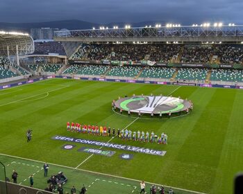 Larne and Shamrock Rovers line up before kick-off at Windsor Park