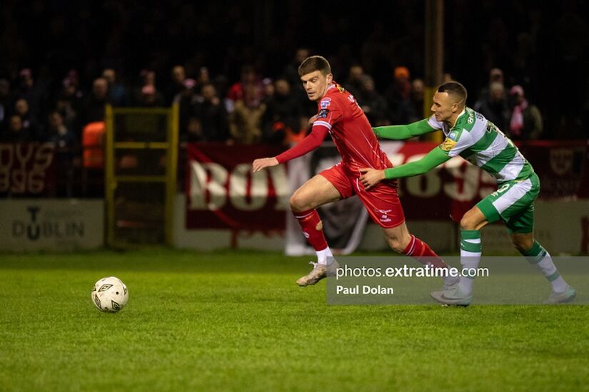 Sean Gannon is dragged back by Graham Burke in Shelbourne's 2-1 win over Shamrock Rovers last month
