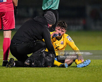 Dale Holland of Cobh Ramblers, receives attention during the Athlone Town v Cobh Ramblers FC