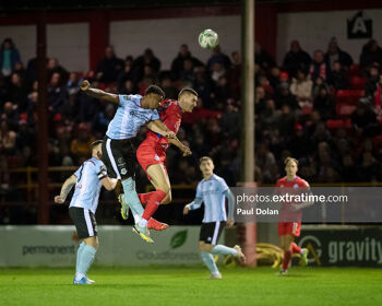 Drogheda United's Elicha Ahui and Shelbourne's Sean Boyd battle it out in the air on Friday, 17 February 2022.