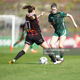 Aoibheann Costello Galway United slips the ball through the legs of Katie Lovely