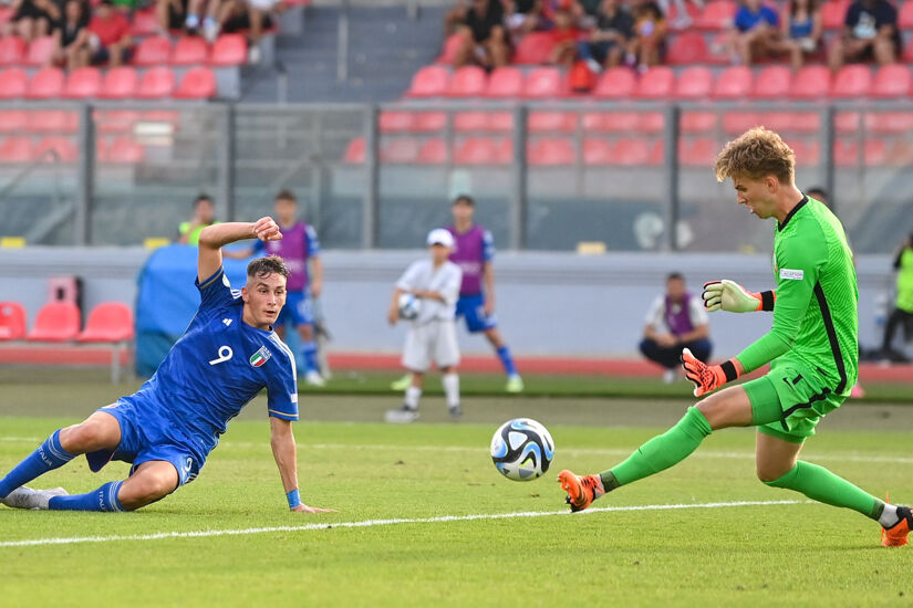 Poland goalkeeper Oliwier Zych makes a save, following a shot on goal from Italy's Francesco Pio Esposito, during the UEFA European Under-19 Championship Finals 2022/23 group A match between Italy and Poland at the National Stadium on July 9, 2023