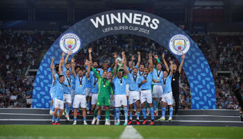 Kyle Walker of Manchester City lifts the UEFA Super Cup trophy after the team's victory in the UEFA Super Cup 2023 match between Manchester City FC and Sevilla FC