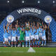 Kyle Walker of Manchester City lifts the UEFA Super Cup trophy after the team's victory in the UEFA Super Cup 2023 match between Manchester City FC and Sevilla FC