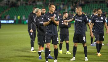 PAOK players, led by #22 Stefan Schwab, applaud the travelling fans following their 2-0 victory at Tallaght Stadium on August 29th, 2024.