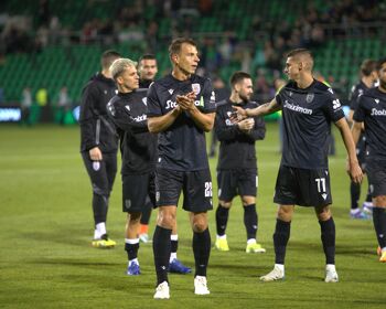 PAOK players, led by #22 Stefan Schwab, applaud the travelling fans following their 2-0 victory at Tallaght Stadium on August 29th, 2024.