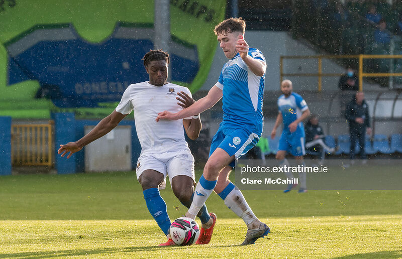 Mark Russell of Finn Harps controls the ball against Oluwatunmise Sobowale of Waterford.