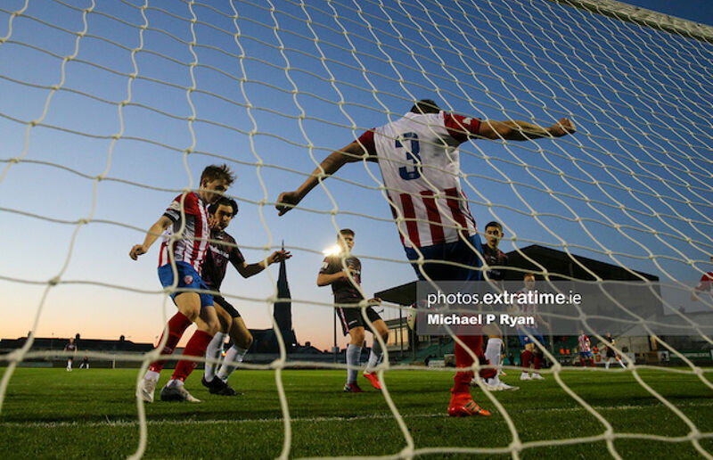 Marc Ludden of Treaty United clears a ball off the line.