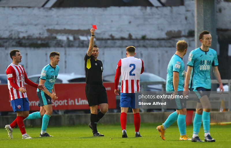 Charlie Fleming receives a red card from referee Declan Toland