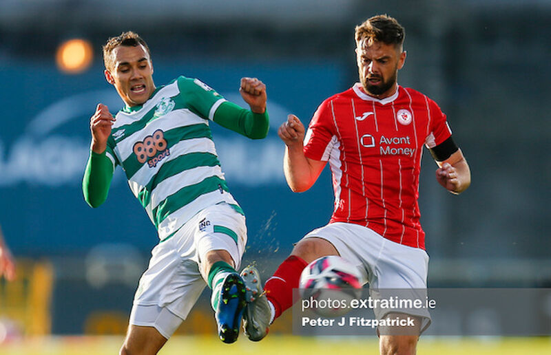 Graham Burke and Greg Bolger challenge for the ball