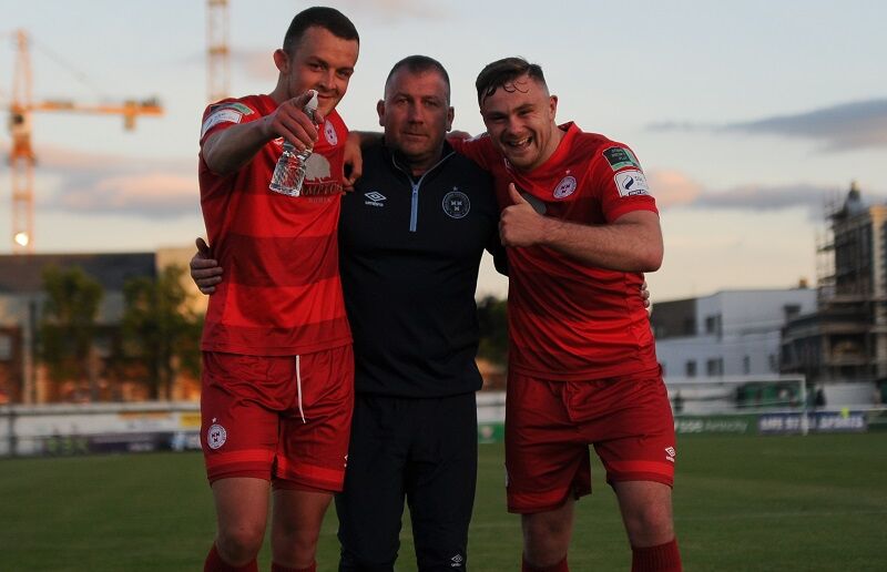 Michael O'Connor and Georgie Poynton flank Shelbourne assistant manager Alan Reynolds.